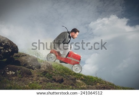Businessman playing with car and goes down