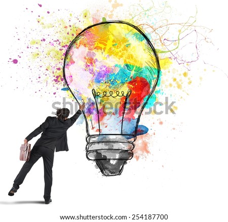 Businessman color with a spray a lightbulb