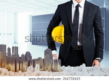 Architect in office shows the urban project
