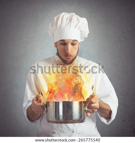 Chef blowing his burnt food in pot