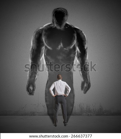 Concept of determination with a businessman and strong shadow