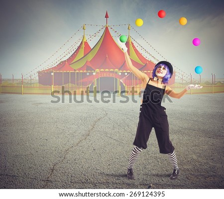 Jester clown in front of circus tent