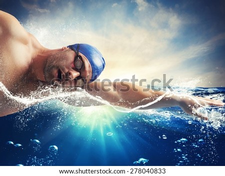 Swimmer swims in the sea in sunshine