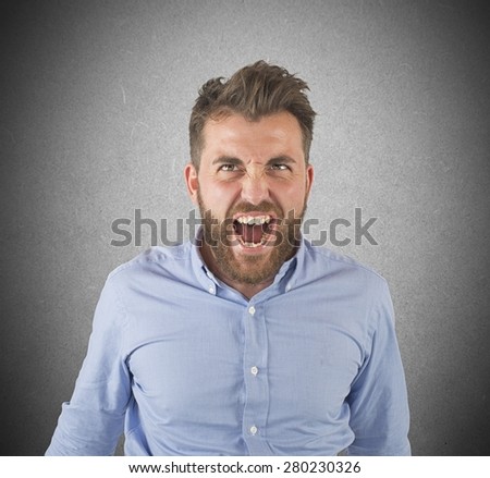 Aggressive businessman stressed out from work screams