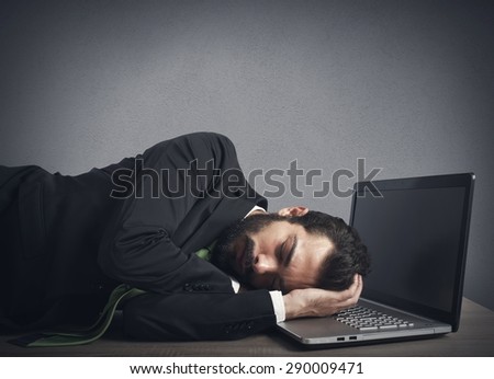 Businessman workload falls asleep tired on computer