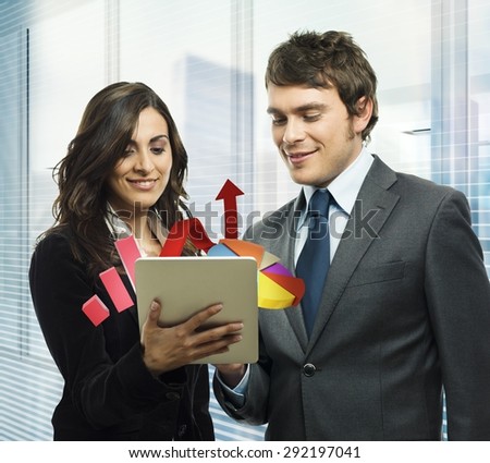 Business people analyze in a tablet graphics