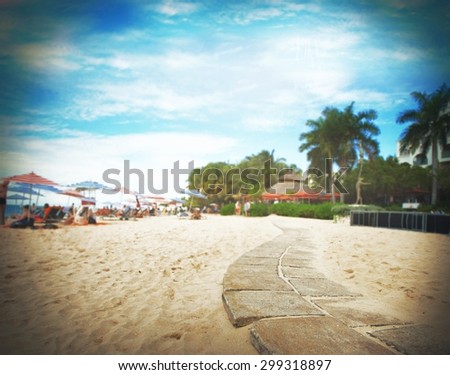 Background tropical beach with umbrellas and chairs