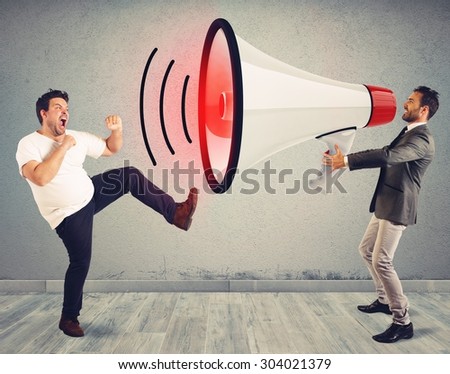 Angry man fights to a big megaphone