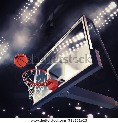 Ball above the basket during basketball game