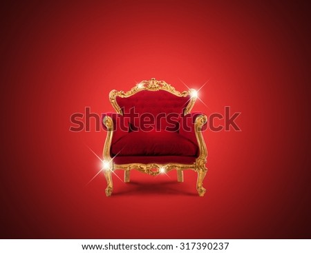 Luxury sparkling golden armchair and red velvet