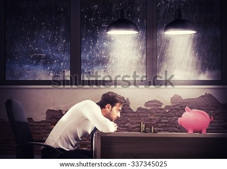 Sad man looks at his last savings