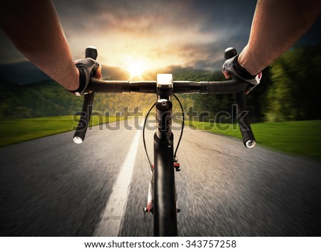 Cyclist pedaling on a street in daylight