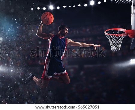Basket player throws the ball at the stadium