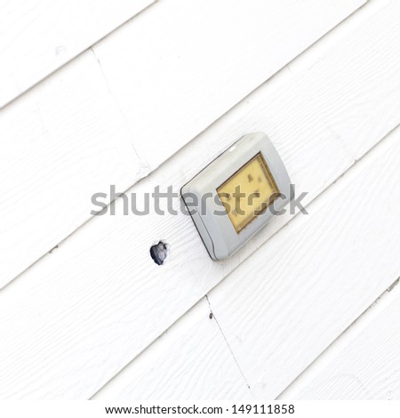 Wall outlet , Electric outlet on the wall covered with wallpaper