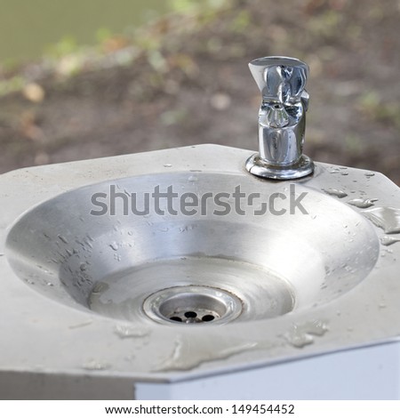 faucet and sink with running water