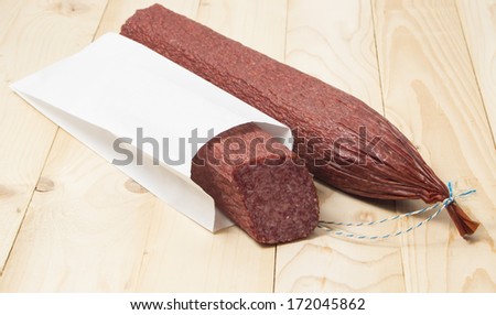 Salami rectangular shape  packing on wooden the surface.