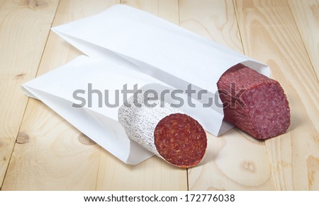 Different sorts  of salami in paper packaging