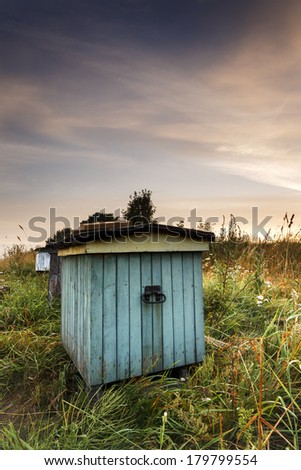 Bee hives in north Poland.Summer sunset.Pomerania district. / Bee hives