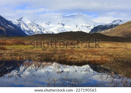 Skaftafell National Park in south Iceland.Glacier and mountains reflecting in water/Skaftafell National Park in Iceland