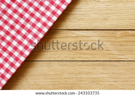 Checkered Tablecloth On The Wooden Background/ Checkered Tablecloth On The Wooden Background