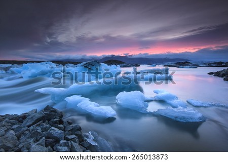 Icebergs floating in Jokulsarlon glacier lagoon lake at sunset. South Iceland/ Jokulsarlon Ice Waterfall