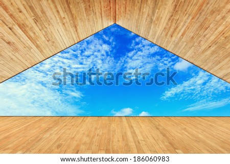 Wood ceiling with decking and blue sky