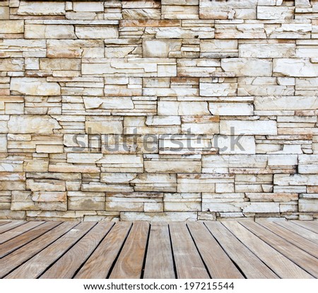 Old stone wall with wood decking