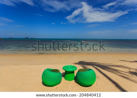 Modern seats stand on the beack, tropical sea and blue sky in Koh Samui, Thailand