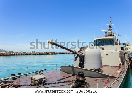 SURATTHANI - JULY 16 : A Thailand Battleship stand at Nathon pier in Koh Samui stand by after National Council for Peace and Order take control of Thailand on July 16, 2014 in Suratthani, Thailand.