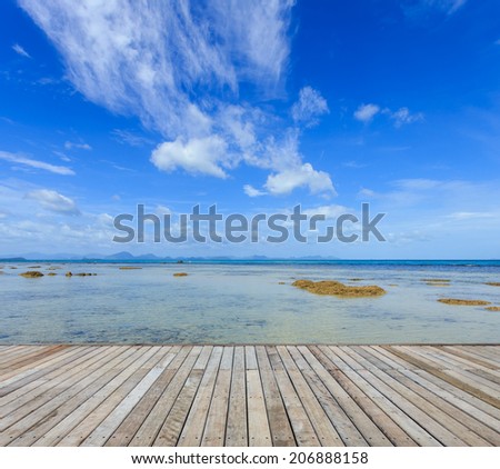 Wood decking and beautiful tropical beach