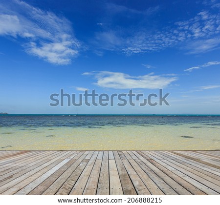 Wood decking and beautiful tropical beach