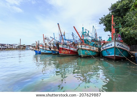 PHUKET - JULY 27 : Fishing boats stand in the harbor To transport fish from the boat to the market which 100% of labor on boat is Burmese on July 27, 2014 in Phuket, Thailand.
