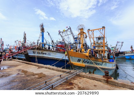 PHUKET - JULY 27 : Fishing boats stand in the harbor To transport fish from the boat to the market which 100% of labor on boat is Burmese on July 27, 2014 in Phuket, Thailand.