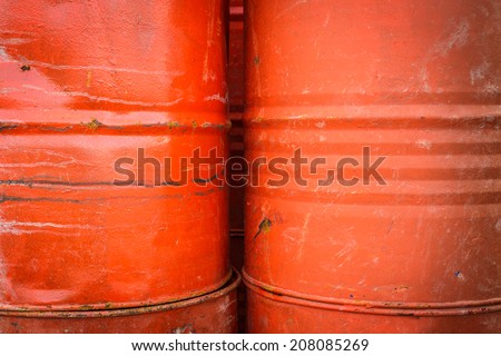 Close up stack of old red barrel or oil-drums