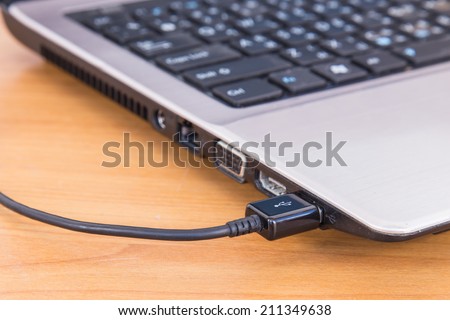 Close up USB cable on laptop