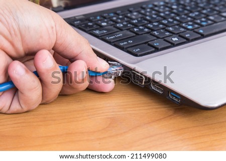 Hand plug ethernet cable to laptop