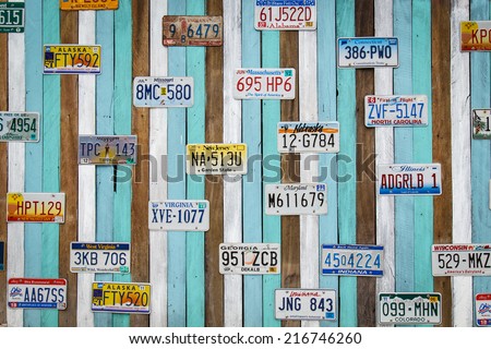 CHA AM THAILAND- AUG 11 : Old US car registration plates on wooden wall at the shop in Cha Am August 11, 14, Cha Am is a beach resort town in Phetchaburi Province, in the way to southern of Thailand