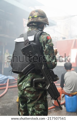 Thai Soldier with gun at the back side