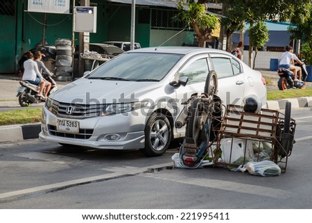 PHUKET, THAILAND - SEPTEMBER 29 : Car accident on the road and crashed with motorcycle which causing the rider serious injury. September 29, 2014 in Phuket Thailand.