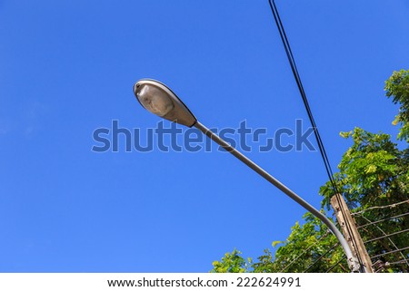 Spot light pole with blue sky in the park