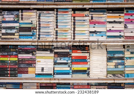 PATONG THAILAND - NOVEMBER 19 : Old books on the shelf for sale at the shop in Patong beach, Patong is a top beach resort town in Phuket, Thailand on November 19, 2014