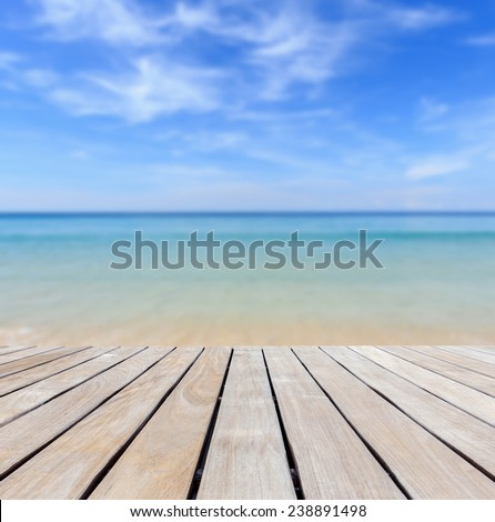 Grey wood decking and tropical beach