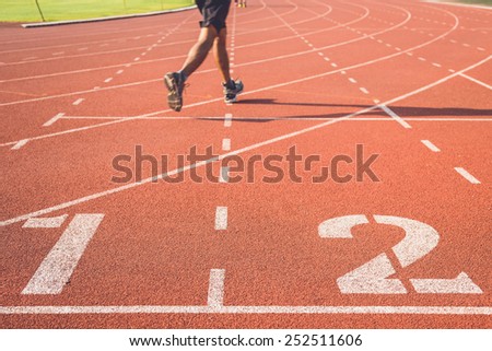 Running track with number and legs of runner