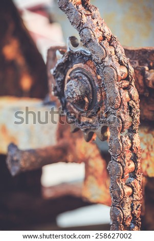 Close up dirty old gear and chain on piling machine
