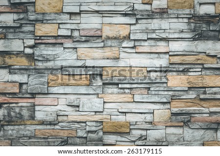 Old natural stone wall for background