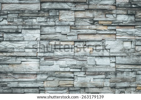Old natural stone wall for background
