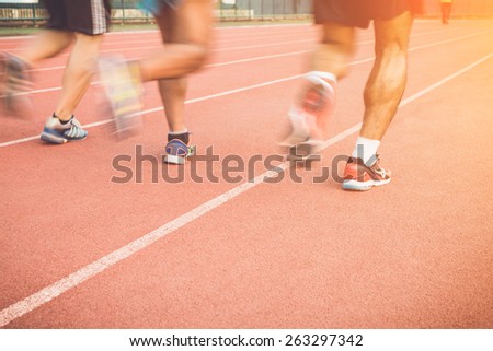 Close up Running track with blur of runner feet in stadium
