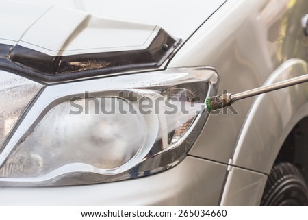Close up Car washing with high pressure water jet