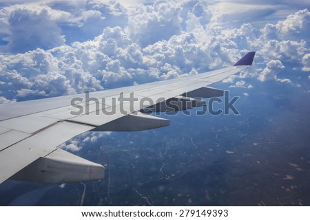 View of beautiful cloud and wing of airplane from window