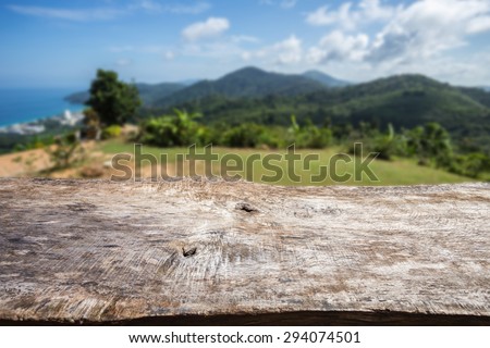 Close up old wood table top and view of ocean